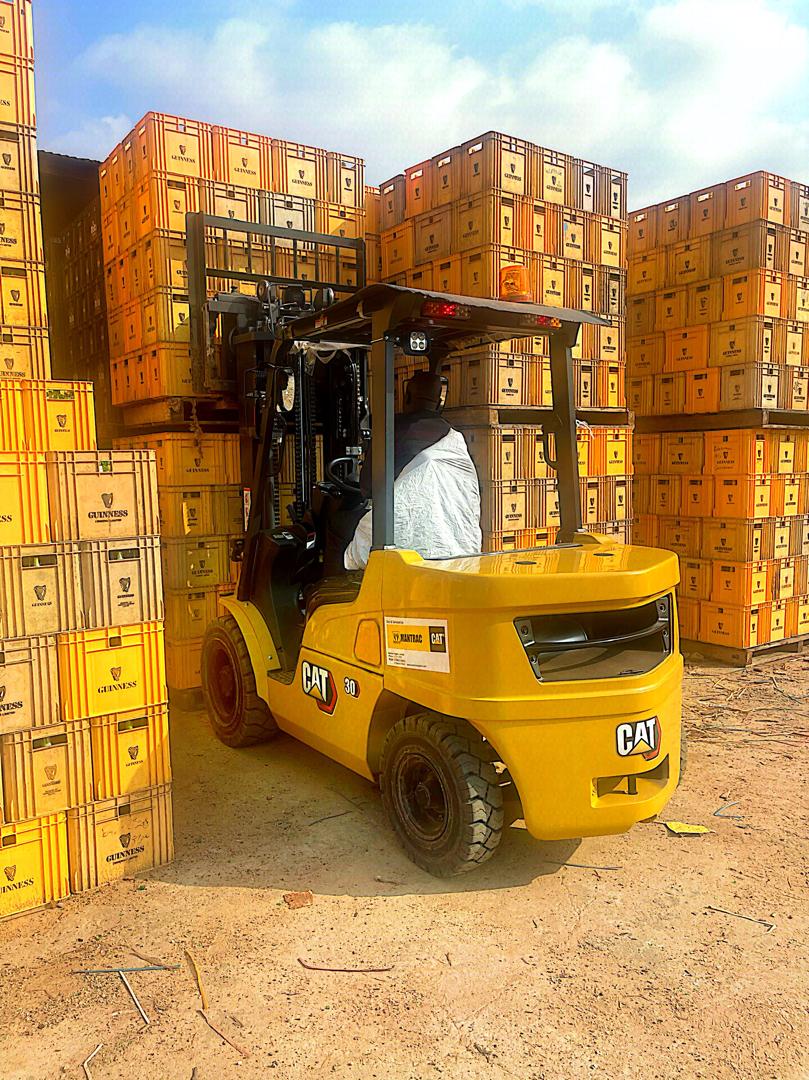 CAT forklift loading Guinness crates in the Anbsolite Accord warehouse