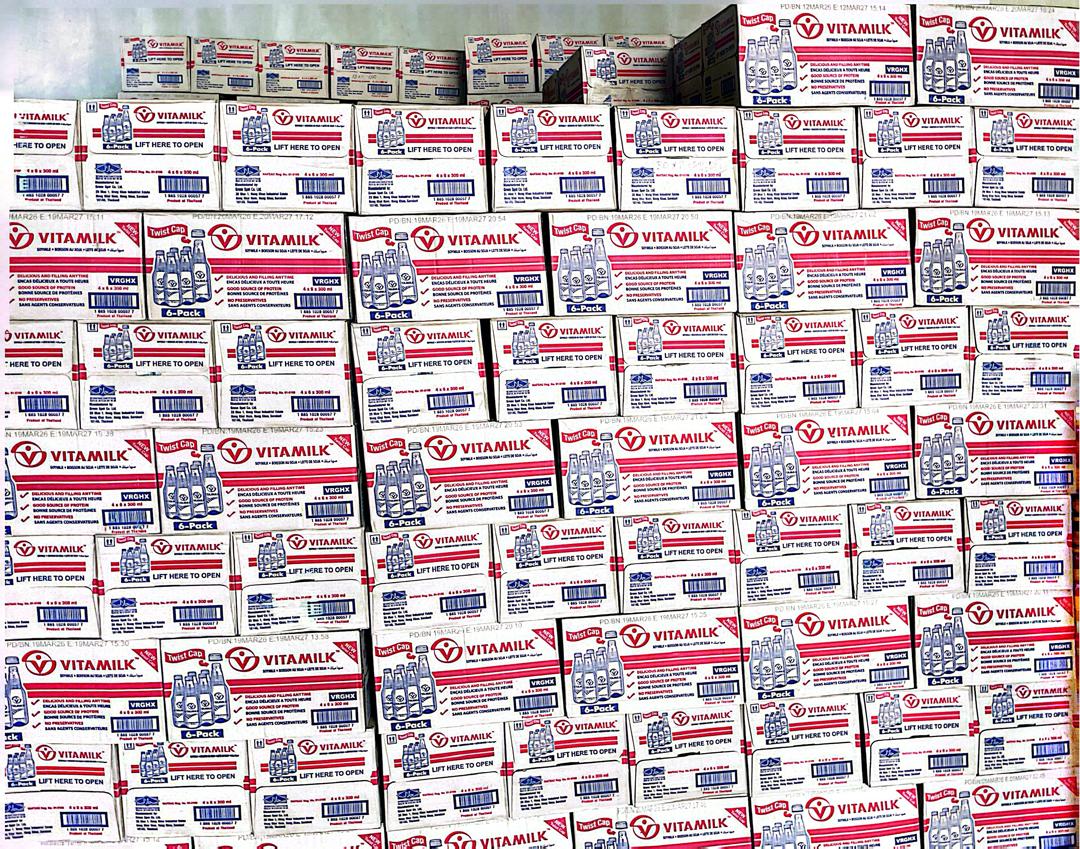 Vitamilk cartons stacked to the ceiling