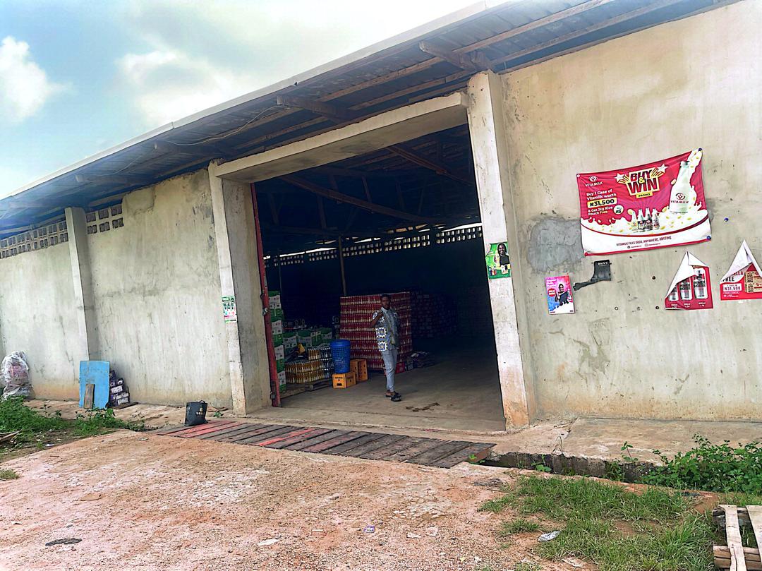 Warehouse entrance with Guinness and drinks stock visible inside